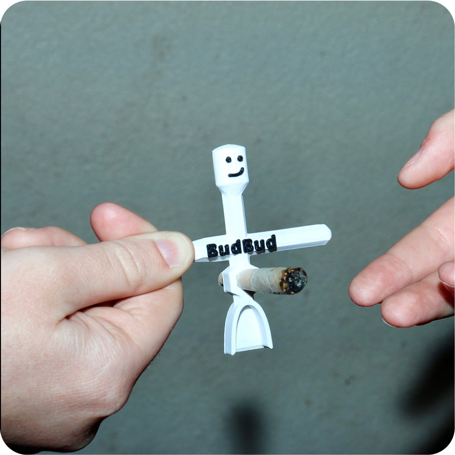 White BudBud holding a joint